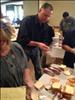 CEO Larry Broughton preparing sandwiches
